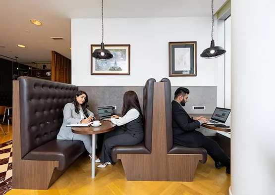 Clients are seen working and meeting in Servcorp’s stylish booth seating area, at Emirates Towers, Dubai